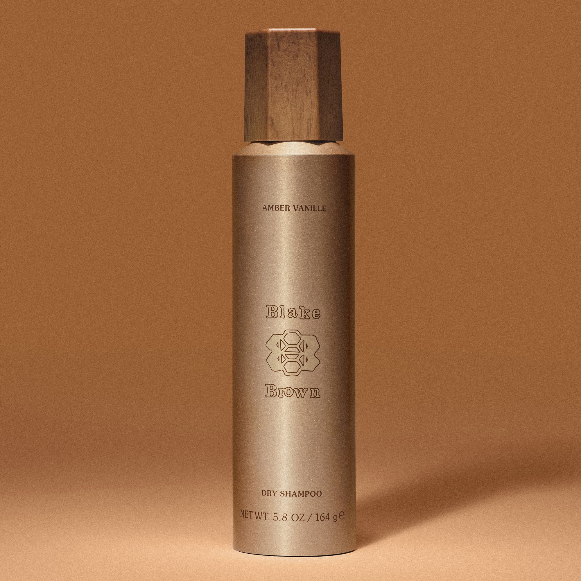 Blake Brown Dry Shampoo by Blake Lively in sleek gold packaging. Scented with Amber Vanille, it refreshes hair while adding hair volume and hair texture.